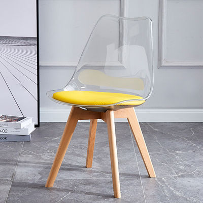 Table à manger en plastique transparent en tulipes Chaises en PU Coussin de hêtre Pieds en bois